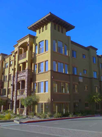 Lots of windows on a luxury apartment building.